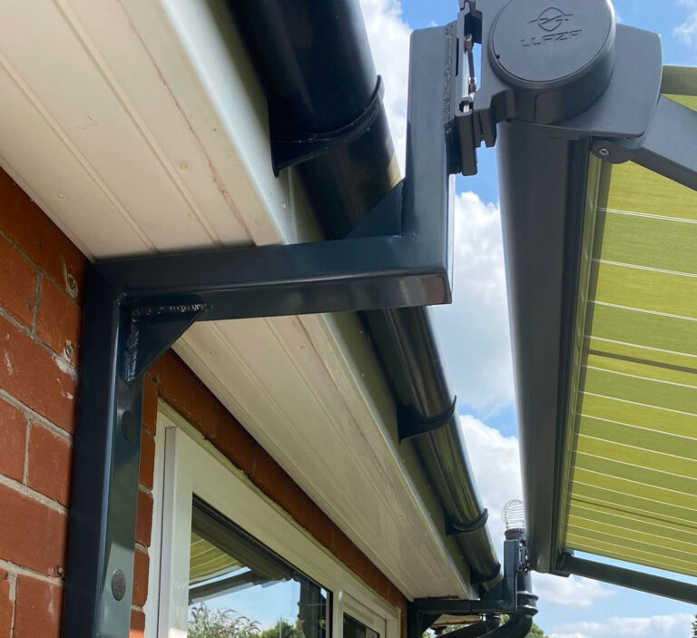 Awning brackets over guttering